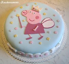 a peppa pig cake with stars and sparkles on the top is ready to be eaten