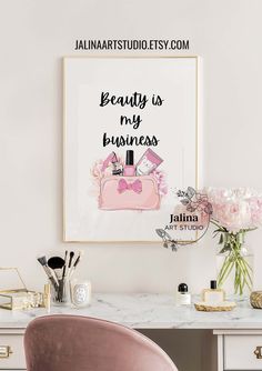 a pink chair sitting in front of a desk with flowers and makeup products on it