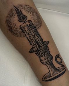 a tattoo on the arm of a person with a lighter in it's hand