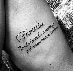 a woman with a tattoo on her stomach that reads,'famila and la vita