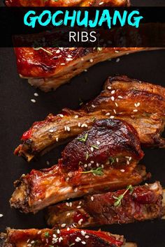 ribs covered in bbq sauce with sesame seeds and garnishes on top