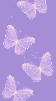 three purple butterflies flying in the air with stars above them on a purple background photo