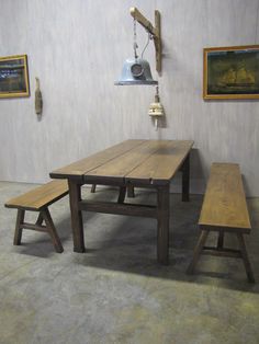 a wooden table and benches in a room