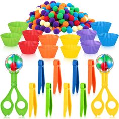 a bunch of colorful cupcake liners and plastic utensils on a white background