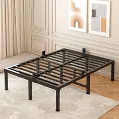 a metal bed frame sitting on top of a wooden floor next to a white rug