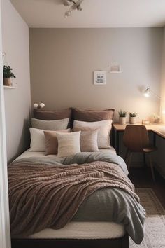 a bed sitting in a bedroom next to a desk