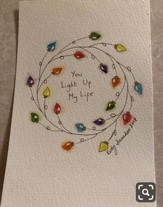 a handmade card with the words, you light up my life and colorful lights around it