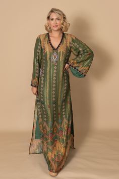 Sparkle and shine in the Palm Royale Kaftan! Made with a sparkling fabric and adorned with sequin embellishments on the neckline, this kaftan is perfect for your next event. Step out in style and make a statement with this stunning piece. Runs small, size up one size unless you are very petite. Traditional V-neck Sequin Dress, Bollywood Style V-neck Party Kaftan, Bollywood Style Sequined V-neck Dress, Bollywood V-neck Sequin Dress, Festive V-neck Kurta For Party, Eid Mirror Work V-neck Dress, Elegant V-neck Kaftan For Festive Occasions, Bollywood Style Embellished V-neck Kaftan, Embellished Flowy V-neck Dress