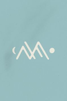 the letter m is written in white on a blue background