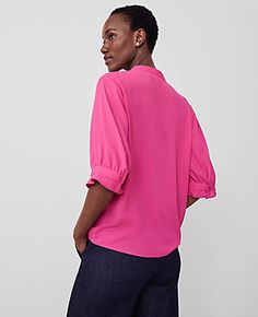 Elevate your wardrobe with the Ann Taylor Pleat Neck Popover Top, a stunning blend of style and comfort. This top features delicate pleats and charming ruffle cuffs that add a touch of sophistication to any outfit. 

- Size: XS
- Color: Hot Pink Poppy
- Material: 100% Polyester
- Gender: Female
- Fit: Blousy - our most relaxed fit
- Length: 25" long
- Care Instructions: Machine Washable

Designed for the modern woman, this top is perfect for both office wear and casual outings. The split neck an Summer Formal Tops With Pleated Sleeves, Spring Solid Tops With Cuffed Sleeves, Chic Spring Tops With Cuffed Sleeves, Chic Tops With Smocked Cuffs For Work, Spring Office Tops With Pleated Sleeves, Spring Pleated Workwear Top, Trendy Pleated Spring Tops, Pleated Top For Spring Workwear, Pink Workwear Top With Blouson Sleeves