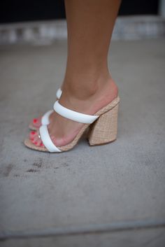 Take a fashionable and comfortable step with our 30A Gardenia Heels (White)! The stylish block heel and open-toe design will keep you on-trend and feeling cozy. Elevate your summer look with these classic white heels. Thick heel, comfy white straps, lined with rafia for a fun twist. White Sandals With 4-inch Heel For Spring, Trendy White Sandals With Sculpted Heel, Trendy White Open Heel Sandals, White Heels For Vacation In Spring, White Heels For Spring Vacation, Trendy White Block Heels With Round Toe, White Block Heel Sandals For Beach, White Block Heel Beach Sandals, White Block Heel Sandals For The Beach