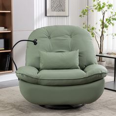 a living room with a green chair and pillows on it's armrests