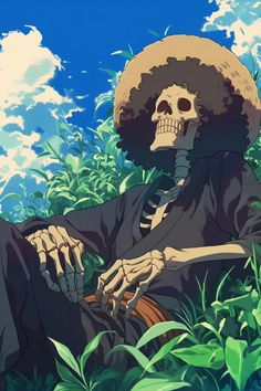 a skeleton sitting in the grass wearing a sombrero and holding a cane with one hand