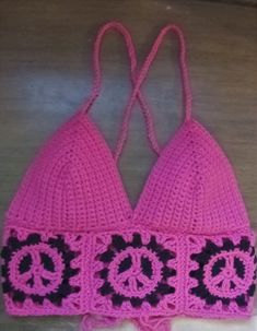 You'll have so much fun wearing this  crocheted crop top this summer with peace signs! ** Custom made to order. This is bubble gum/hot pink! Or you can choose all black top, or one side hot pink and the other black! May also choose any of your favorite colors for the top and peace signs. Pink Crochet Halter Top For Vacation, Pink Cotton Crochet Top Trendy, Pink Crochet Crop Top For Vacation, Pink Crochet Halter Top For Spring, Spring Pink Crochet Halter Top, Trendy Pink Crochet Top, Trendy Pink Triangle Crop Top, Casual Handmade Pink Tops, Pink Crochet Top For Festival