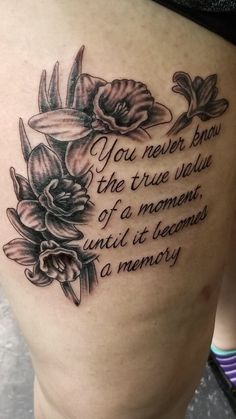 a woman's thigh with flowers on it that says you never know the true story of a moment, until it becomes a memory