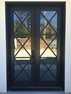 two black double doors with glass on the outside