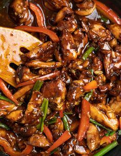 the food is being cooked and ready to be eaten in the wok on the table