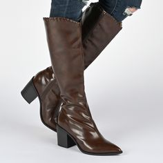 The Daria boot from Journee Collection blends sophistication with comfort in its pointed-toe design and practical zipper closure. With a striking 14-inch shaft height, these boots make a bold fashion statement. Featuring a 4 mm Tru Comfort Foam™ footbed and a stylish 3 1/4-inch block heel, the Daria boot with faux leather uppers is a versatile and chic option for those seeking both style and support. Please refer to size chart for calf measurements. • Pointed-Toe • Zipper • 14 - in Shaft Height Cowgirl Chic, Journee Collection, Country Chic, Toe Designs, Cowgirl Boots, Bold Fashion, Knee High Boots, A 4, Fashion Statement