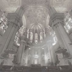 the interior of an old church with pews and stained glass windows on the ceiling