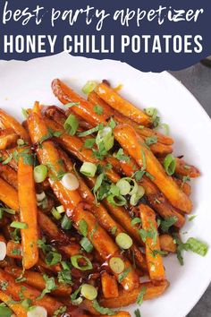 a white plate topped with honey chili potatoes