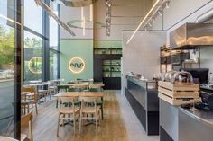 the inside of a restaurant with tables and chairs