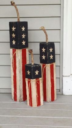 three red, white and blue boxes with stars on them sitting in front of a house