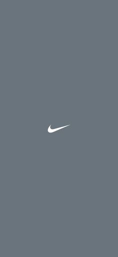 the nike logo is shown in white on a gray background