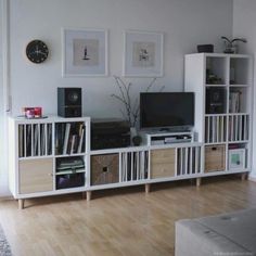 a living room filled with lots of furniture and bookshelves