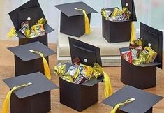 graduation cap boxes filled with candy and candies