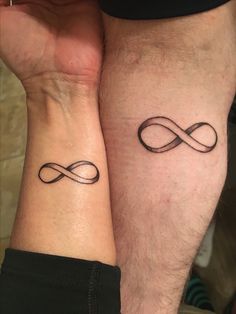 two people with matching tattoos on their arms