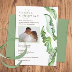 an image of a wedding card with green leaves on the front and back, featuring a photo of a bride and groom