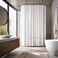 a white shower curtain in a bathroom next to a bathtub and sink with a large window