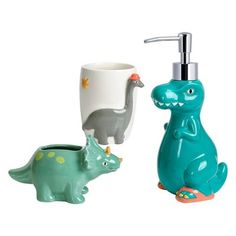 two dinosaur shaped soap dispensers next to each other on a white background