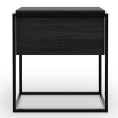 the side table is made from black wood and has an open drawer on one side