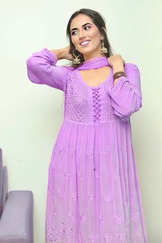 Purple anarkali with chikankari hand embroidery, tie-up detail and mukaish work. Paired with chiffon dupatta.
Component: 2
Pattern: Hand Embroidery
Type Of Work: Mukaish, Chikankari
Neckline: U neck
Sleeve Type: Three Quarter Sleeves
Fabric: Georgette, Chiffon
Color: Purple
Other Details: 
Floral motifs
Occasion: Puja - Aza Fashions Georgette Churidar With Dori Work And Long Sleeves, Long Sleeve Georgette Churidar With Dori Work, Purple Anarkali Set With Chikankari Embroidery For Eid, Purple Churidar With Chikankari Embroidery And Long Sleeves, Purple Chikankari Anarkali Set For Eid, Purple Georgette Anarkali Set With Intricate Embroidery, Purple Chikankari Embroidered Anarkali Set For Wedding, Purple Anarkali Set With Chikankari Embroidery For Wedding, Purple Anarkali Set With Intricate Embroidery