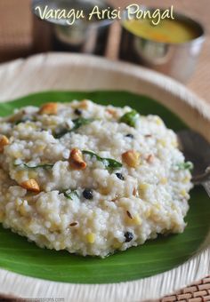 a green plate topped with rice and nuts