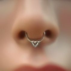 a nose ring with a heart on it