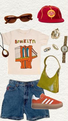 an assortment of clothing, shoes and accessories including a t - shirt with the brooklyn bridge on it