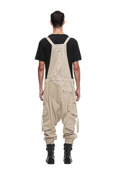 Overalls by JONNY COTA have arrived this season, crafted from luxe stretch cotton with customized Jonny Cota engraved hardware. Front pocket at chest Dual asymmetrical button slash pockets at hip Single cargo pocket on each leg Single pocket on back 95% cotton/5% spandex SIZE + FIT Loose, tapered, drop crotch fit Elastic cuffs The model is 6'2 and wearing a size M CARE Hand wash cold with colors, lay flat to dry Cargo Overalls, Men Jumpsuit, Game Room Design, Cargo Pocket, Peter Pan, Stretch Cotton, Game Room, Lay Flat, Front Pocket