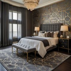 a bedroom with a large bed and chandelier