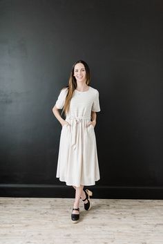 This modest dress has short sleeves and stripes. It is cream with black stripes. It is midi and great for summer and fall. It has pockets and a tie at the waist. Buy now! #stripeddress #modest Sweater Maxi Dress, Modest Dress, Ladies Dress Design, Modest Dresses, Spring Dresses, Modest Outfits, Fall Dresses