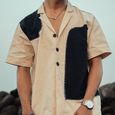 An Ivory Shirt with a Cuban collar in pure cotton canvas. This ivory shirt has minimal hand embroidery highlighting the panels with large black buttons. Trending Shirts For Men, Gents Wear, Cuban Shirt, Cuban Collar Shirt, Embroidery Clothing, New Shirt Design, Cuban Shirts, Shirt Outfit Men, Shirt Designs For Men