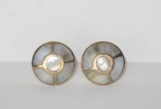 pair of gold and mother of pearl earrings