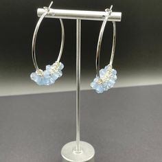 Silver and light blue hoop earrings. Beads are frosted and shiny light blue crystal beads hand wrapped on anti tarnish head pin. Hoops measure 50mm (1.97 inches) and are made of silver plated anti tarnish stainless steel. Affordable Light Blue Metal Jewelry, Blue Hoop Earrings, Blue Crystal Beads, Earrings Beads, Head Pins, Hand Wrap, Jewelry Earrings Hoops, Silver Hoops, Blue Crystals