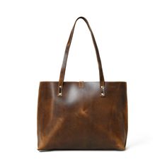 Step out in style with our handcrafted Buffalo Terry Tote. Made from luxurious Buffalo leather, this plain tote boasts a modern look and finish, perfect for your daily needs. Elevate any outfit with this sophisticated and exclusive accessory. Coffee Brown color Handcrafted & made of buffalo leather Top Handle and inside pocket Lightweight & durable leather Size in Inch 15W x 11H x 4 D Inch Size in Cm 38.1W x 27.94H x 10.16D Cm Timeless Everyday Bag With Leather Backing, Classic Brown Bag For Everyday, Timeless Brown Shoulder Bag For Everyday, Classic Everyday Brown Bag, Timeless Brown Everyday Shoulder Bag, Classic Brown Shoulder Bag For Everyday, Classic Everyday Shoulder Bag In Vegetable Tanned Leather, Classic Vegetable Tanned Leather Shoulder Bag For Everyday, Classic Brown Oiled Leather Bag