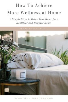 a bed with white sheets and flowers on it in front of a mirror that says how to achieve more wellness at home