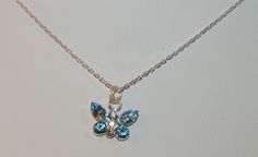 This handmade "Lacy" design is made with beautiful clear and aqua crystals forming an elegant butterfly on an 16-18" adjustable Gossamer Diamond Cut 1mm Sterling Silver necklace. This beautiful necklace brings out the divine connection, eternal transformation, hope, and balance butterflies can represent. This shimmering necklace looks great on the job, every day, or out on the town.  Each piece has a beautiful design name, inspired to bring out the feminine energy in each one of us.  ALL Sterlin Elegant Adjustable Butterfly Necklace As Gift, Butterfly-shaped Crystal Jewelry For Gifts, Butterfly Shaped Crystal Jewelry For Gifts, Butterfly-shaped Crystal Jewelry Gift, Aqua Crystals, Unique Gift Items, Crystal Butterfly, For Her Gifts, Creating Jewelry