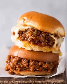 two sloppy joe sandwiches stacked on top of each other