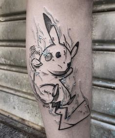 a tattoo on the leg of a man with an image of a pikachu