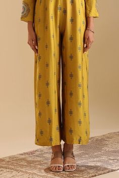 Yellow full length jumpsuit with all over floral butti prints. Paired with a jacket with floral mandala prints and sequin embellishments. - Aza Fashions Fitted Ankle-length Sets With Printed Motifs, Fitted Pants For Festive Occasion, Traditional Fitted Sets With Wide Leg, Traditional Fitted Set With Wide Leg, Fitted Printed Palazzo Set For Festive Occasions, Printed Sets With Straight Pants, Festive Fitted Printed Palazzo Set, Fitted Workwear Sets With Printed Motifs, Fitted Sets With Printed Motifs For Workwear